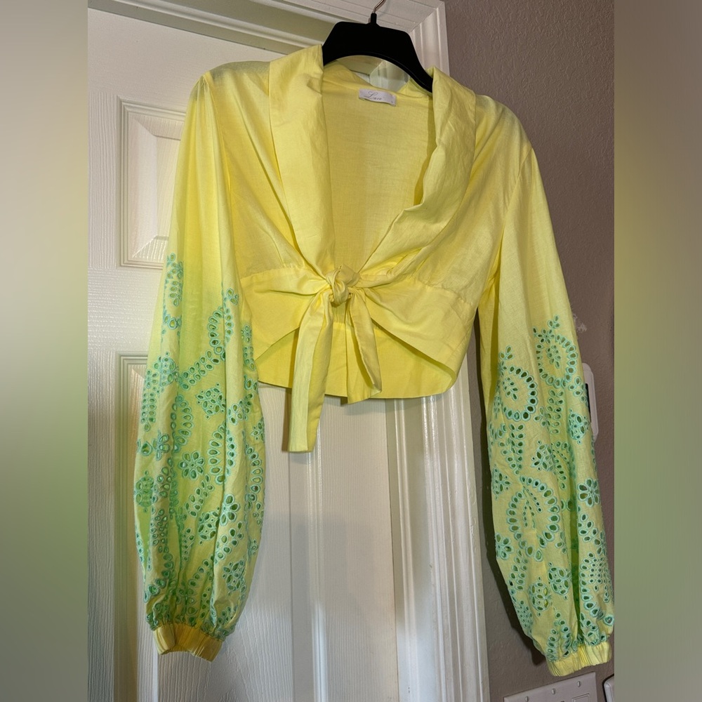 Lace, Greek designer shows a tie front top, long sleeve light weight cotton SzS